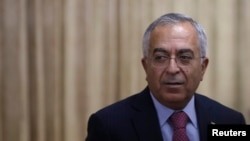 L'ancien Premier ministre palestinien Salam Fayyad, candidat émissaire des Nations unies en Libye, ici lors de la Conférence des pays de l’Asie de l’est pour le développement palestinien à Tokyo, 13 février 2013.