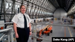 In this May 15, 2017 photo, Kristen Arambula, an airship pilot, poses for a picture in the Goodyear hangar in Akron, Ohio. (AP Photo/Dake Kang)