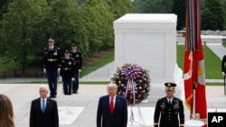President Donald Trump stands with Vice President Mike Pence and Gen Omar Jones, Commanding General at Joint Force Headquarters, attend Memorial Day ceremony, May 25, 2020. 