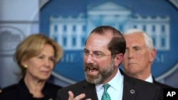 Department of Health and Human Services Secretary Alex Azar, with White House coronavirus response coordinator Dr. Deborah Birx, left, and Vice President Mike Pence, speaks to reporters ,March 2, 2020, in Washington. 