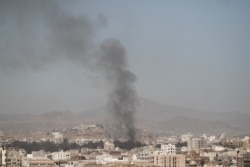 FILE - Smoke rises after an airstrike in Sanaa, Yemen, Dec. 15, 2017.