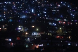 A slum colony is decorated with lanterns and lights as they celebrate Diwali, the Hindu festival of lights, in Mumbai, India.