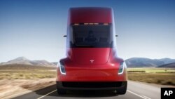 This photo provided by Tesla shows the front of the new electric semitractor-trailer unveiled on Thursday, Nov. 16, 2017. (Tesla)