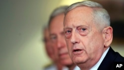 FILE - Secretary of Defense Jim Mattis, responds to a reporter's question at the Pentagon, Sept. 19, 2017. 