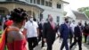 Suriname's President Chan Santokhi and U.S. Secretary of State Mike Pompeo walk together, in Paramaribo, Suriname, Sept. 17, 2020.