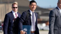 Acting-Secretary of Homeland Security Chad Wolf, center, arrives to join President Donald Trump at Andrews Air Force Base in Md., Aug. 18, 2020.