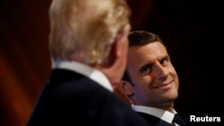French President Emmanuel Macron (R) and U.S. President Donald Trump attend a joint news conference at the Elysee Palace in Paris, France, July 13, 2017.