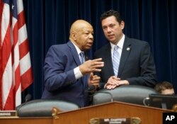 House Oversight Committee Chairman Jason Chaffetz, R-Utah, right, confers with the committee's ranking Democrat, Rep. Elijah Cummings of Maryland, on Capitol Hill in Washington, July 7, 2016, prior to hearing testimony from FBI Director James Comey on the agency's recommendation to not prosecute Hillary Clinton over her use of a private email server as secretary of state.