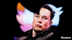 FILE PHOTO: Illustration shows Elon Musk's photo and Twitter logo
