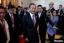 China's Foreign Minister Wang Yi arrives at a meeting at the sidelines of the ASEAN foreign ministers meeting in Vientiane, Laos July 25, 2016.