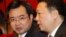 FILE - Nguyen Thanh Nghi, left, pictured with Vietnamese Vice Minister of National Resources and Environment Tran Hong Ha in 2011, has become one of the youngest provincial party chiefs in Vietnam at age 39.