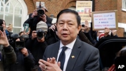 Myanmar's ambassador to the UK, Kyaw Zwar Minn speaks to the media outside the Myanmar Embassy in London, April 8, 2021.