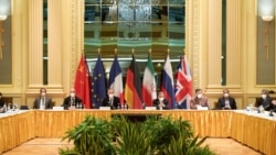 FILE - Attendees wait for the start of a meeting of the JCPOA Joint Commission in Vienna, Austria, April 17, 2021. (EU Delegation in Vienna/Handout via Reuters)