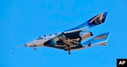 Virgin Galactic reaches space for the first time during its 4th powered flight from Mojave, Calif.
