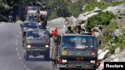 FILE - An Indian Army convoy moves along a highway leading to Ladakh, at Gagangeer in Kashmir's Ganderbal district, June 18, 2020.