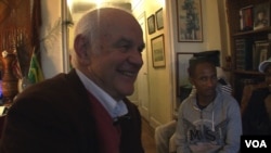 Bill Staab in his New York apartment with some Ethiopian visitors.