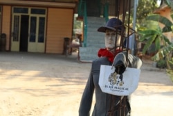 A scarecrow residents planted in front of their house in hope to ward off evil spirits in Kandal province, Cambodia. (Sun Narin/VOA Khmer)