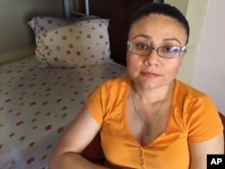 FILE - Rosa Robles Loreto sits in her small room at Southside Presbyterian Church in Tucson, Ariz., where she has taken sanctuary from deportation for a year, July 30, 2015.