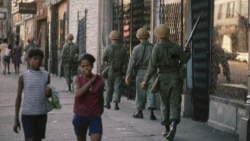 FILE - In this April 6, 1968 file photo, National Guard patrol the streets in Chicago, following rioting and violence that ensued after the news of the assassination of Dr. Martin Luther King, Jr. (AP Photo/File)