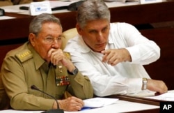 FILE - In this July 6, 2013 file photo, Cuba's President Raul Castro, left, and Vice President Miguel Diaz-Canel Bermudez attend the opening of a two-day, twice-annual legislative sessions, at the National Assembly in Havana, Cuba