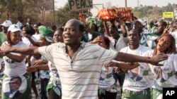 Supporters of the ruling Patriotic Front celebrate the results of the presidential election in Lusaka, Zambia, Aug. 15, 2016.