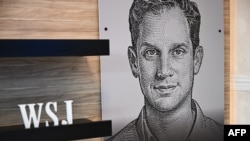 ARHIVA - Ilustracija Evana Gerškoviča na konferenciji Vol strit džurnala u Kaliforniji (Foto: AFP/Patrick T. Fallon)