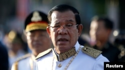 In this photo taken on Nov. 9, 2018, Cambodia's Prime Minister Hun Sen arrives at the Independence Monument to attend celebrations marking the 65th anniversary of the country's independence from France, in Phnom Penh, Cambodia.