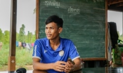 Tak Saroum, 25, teaches grade 5 students at Sre Andong Pi Primary School along with his wife, Soeun Sreynith, in Samlout district, Battambang province, Cambodia, on June 17, 2020. (Hean Socheata/VOA Khmer)
