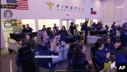 Staff at the Mission Control outside Austin, Texas celebrating as lunar lander Blue Ghost touches down on the moon with a special delivery for NASA, Sunday, March 2, 2025. (NASA/Firefly Aerospace via AP)