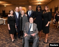 Former U.S. Presidents and former U.S. first ladies Laura Bush, George W. Bush, Bill Clinton, Hillary Clinton, Barack Obama, Michelle Obama, and first lady Melania Trump pose with former U.S. President George H.W. Bush at the funeral of Barbara Bush in Houston