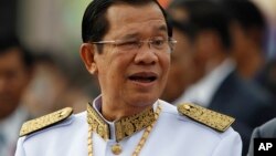 Cambodia's Prime Minister Hun Sen waits to attend the Independence Day celebrations in Phnom Penh, Cambodia, Thursday, Nov. 9, 2017. Some hundreds of civil servants and students gathered to mark the country's 64th Independence Day. The country gained independence from France on Nov. 9, 1953. (AP Photo/Heng Sinith)