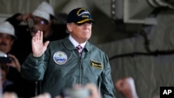 President Donald Trump aboard a Naval ship on Thursday.
