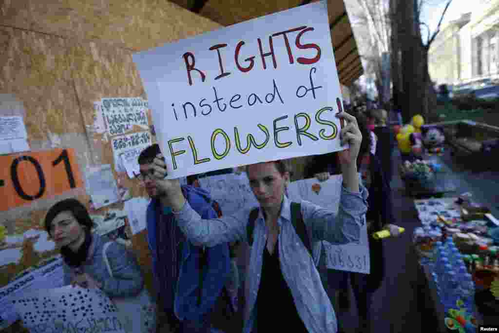 People march on the street to mark the International Women's Day in Tbilisi, Georgia, March 8, 2016. 