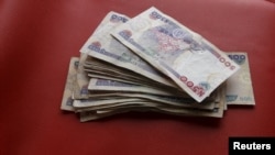 Nigerian naira notes are seen in this picture illustration March 15, 2016. 
