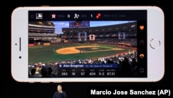 Phil Schiller, Apple's senior vice president of worldwide marketing, shows features of the new iPhone 8.