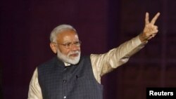 Indian Prime Minister Narendra Modi gestures toward his supporters after the election results at Bharatiya Janata Party (BJP) headquarter in New Delhi, India, May 23, 2019. (REUTERS/Adnan Abidi)