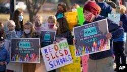 FILE - Students who attend Salt Lake City School District schools rally at East High School Monday, Dec. 7, 2020, in Salt Lake City, urging the school board and administrators to restart in-person learning. (AP Photo/Rick Bowmer)