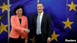 Facebook Chairman and CEO Mark Zuckerberg meets with European Commissioner for Values and Transparency Vera Jourova at the EU Commission headquarters in Brussels, Belgium, Feb. 17, 2020.