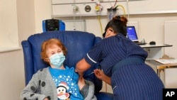  Margaret Keenan, 90, is the first patient in the UK to receive the Pfizer-BioNTech COVID-19 vaccine, at University Hospital, Coventry, England, Dec. 8, 2020.