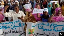 FILE - Mauritanian anti-slavery protesters march to demand the release of imprisoned abolitionist leader Biram Ould Abeid in Nouakchott, May 26, 2012. Slavery still exists in some parts of Mauritania.