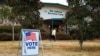 Voters return to their vehicles after early voting for the Senate runoff election, at Ron Anderson Recreation Center, Dec. 17, 2020, in Powder Springs, Ga. 