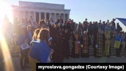 Britain's Prime Minister Boris Johnson drives a JCB through a symbolic wall with the Conservative Party slogan 'Get Brexit Done' in the digger bucket, during an election campaign event at the JCB manufacturing facility in Uttoxeter, England.