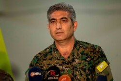 Redor Khalil, a Kurdish official in the Syrian Democratic Forces, speaks during a press conference in Hassakeh, Oct. 12, 2019.