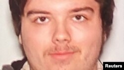 A photograph of Ryan Christopher Palmeter, 21, is shown at a news conference in Jacksonville