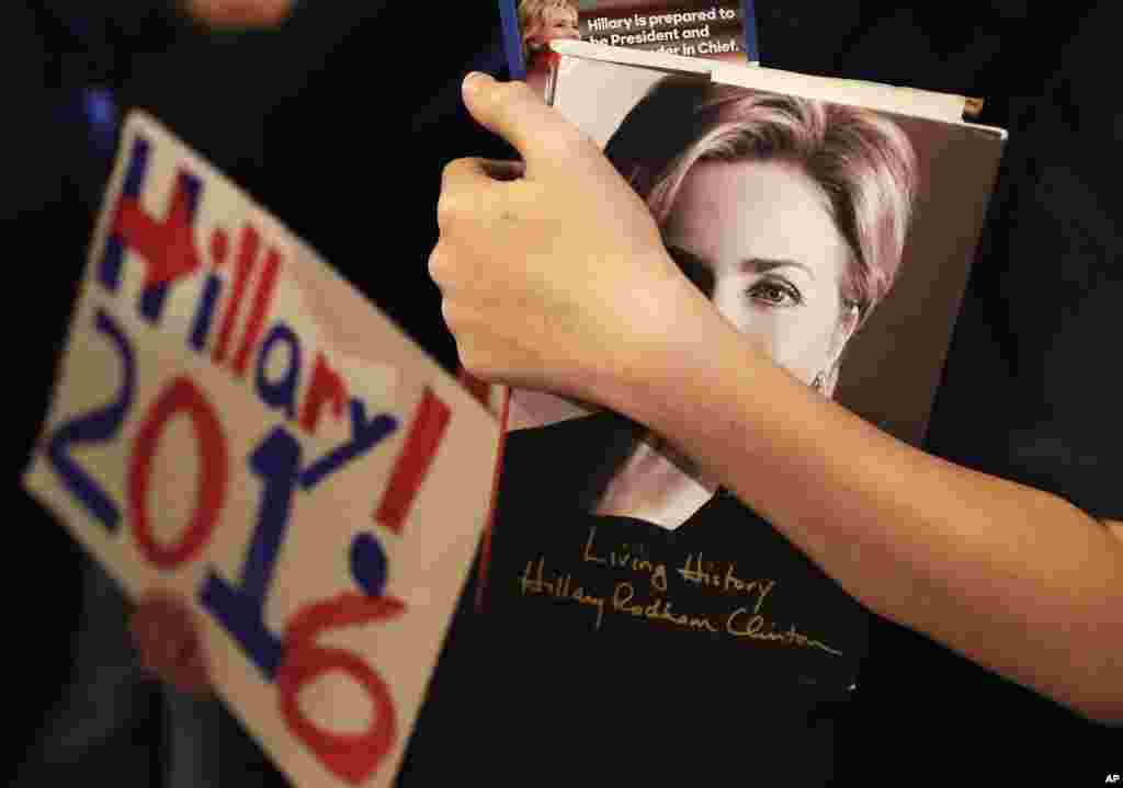 Patrick Chappel of Columbus, Georgia, holds a copy of Democratic presidential candidate Hillary Clinton's book while waiting to enter a campaign event at the Old City Council Chambers in City Hall in Atlanta. Democrats vote in a primary in South Carolina on Saturday.