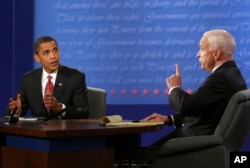 FILE - Democratic presidential candidate Sen. Barack Obama, D-Ill., and Republican presidential candidate Sen. John McCain, R-Ariz., talk during the presidential debate, Oct. 15, 2008, at Hofstra University in Hempstead, N.Y.