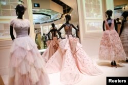 Creations on display during a photocall for the "Christian Dior: Designer of Dreams" exhibition at the Victoria & Albert (V&A) Museum in London, Jan. 30, 2019.