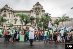 Scientist Professor Salim Abdool Karim, a South African epidemiologist and infectious diseases specialist, and one of the conveners of the march leads people during the 'March for Science' in Durban on April 14, 2018.