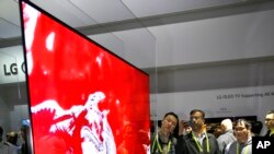 IMAGE DISTRIBUTED FOR LG ELECTRONICS - CES 2017 attendees get their first glimpse of the LG SIGNATURE 77W7 OLED, the world’s first ultra-thin Picture-On-Wall OLED TV, more popularly known as the “Wallpaper TV” on Thursday, Jan. 5, 2017, in Las Vegas.