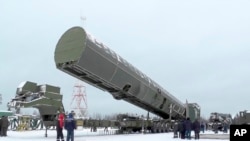 FILE - Russia's new Sarmat intercontinental missile is shown at an undisclosed location in Russia, in this video grab provided by RU-RTR Russian television via AP television March 1, 2018.